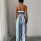 📢📢50% OFF !! ⏰Geometric Jumpsuit with Halter Neckline & Side Slit – Unique print & elastic back – Versatile, perfect for summer parties or resort wear ✨