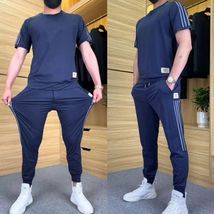 2-delt sæt med kortærmet top og joggingbukser i høj elasticitet til mænd