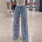 Jeans i patchwork-design med blonder