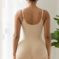 Shapewear-bodysuit med lynlås til kvinder, der former maven